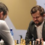 Champ Carlsen suffers, but holds draw to keep chess title fight tied