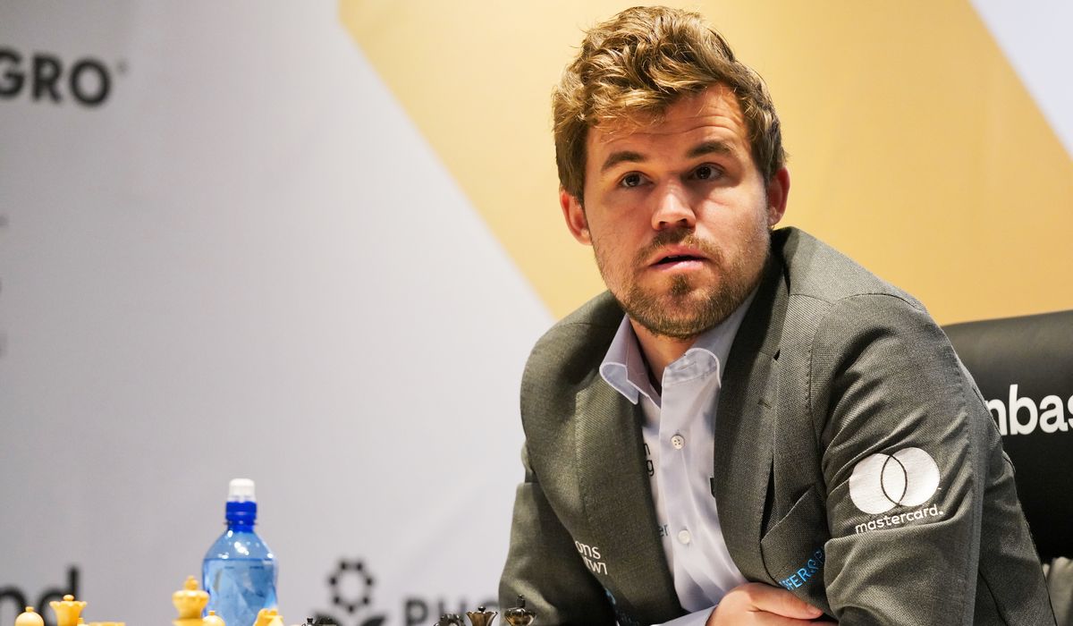 Magnus Carlsen retains world chess crown with brilliant attack in clinching game