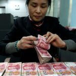 China’s Offshore Currency Hits Record Low Against Dollar